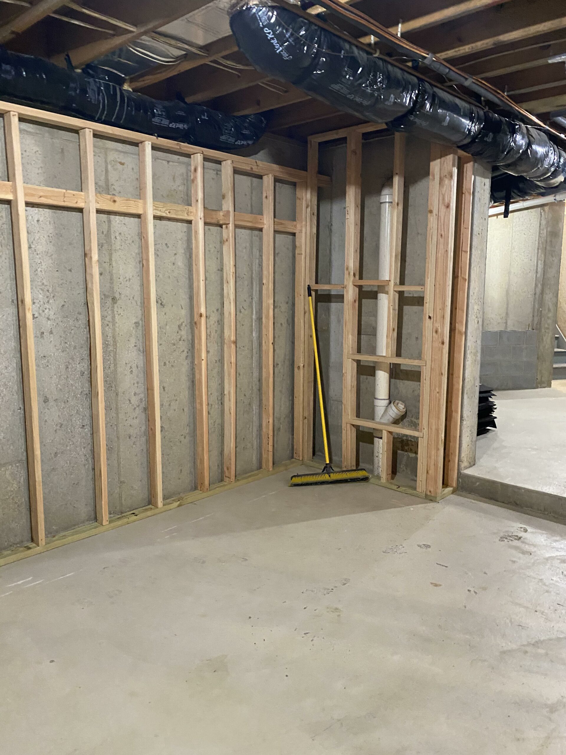 Unfinished basement framing before gym build